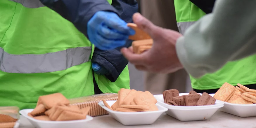 Free food on a stand being offered to those in need
